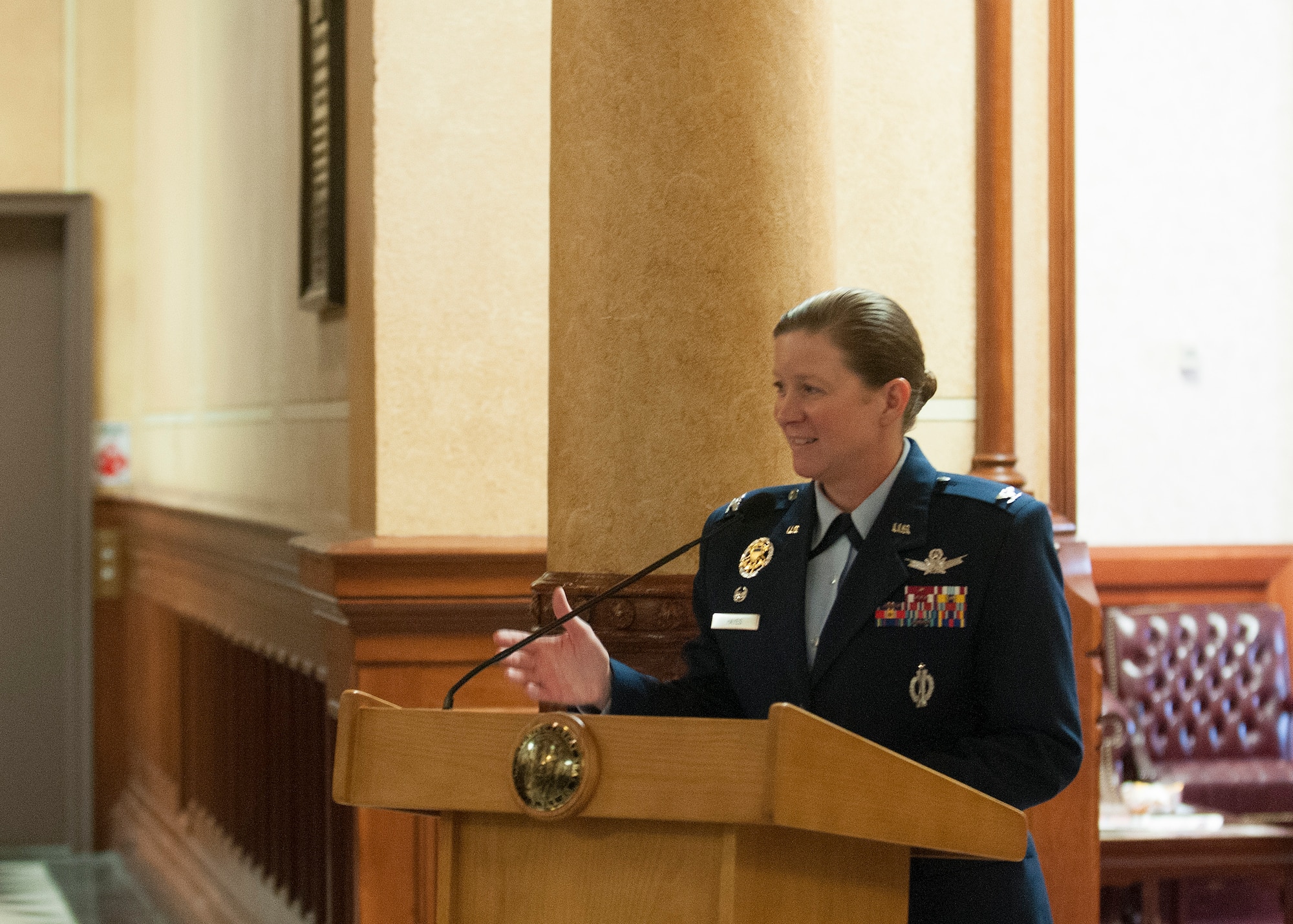 Col. Tracy Hayes, 90th Missile Wing commander speaks at a Military Appreciation Day proclamation signing event in the Wyoming Capitol May 15, 2015. The event honored the men and women who have served our country. (U.S. Air Force Photo by Lan Kim)