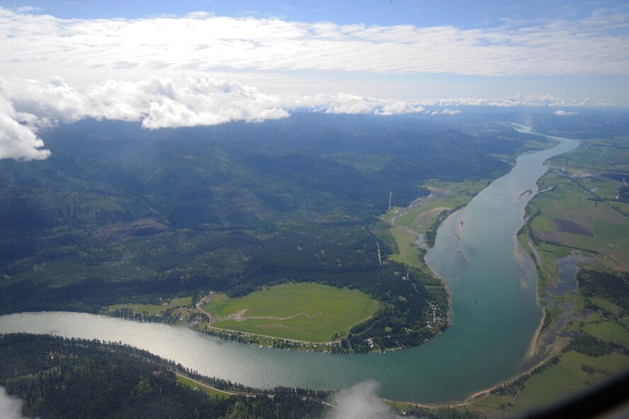 During the re-enlistment flight, the views of the mountains and the Survival, Evasion, Resistance and Escape training areas were in view through the windows of the Cessna II 182 P aircraft. Staff Sgt. Sean Osborn 92nd Communications Squadron, radio frequencies transmission systems NCO in charge, was re-enlisted during the flight over the S.E.R.E training area in the Colville National Forest because he and his team support the S.E.R.E school with radio communications. (U.S. Air Force photo/Nicolo J. Daniello)
