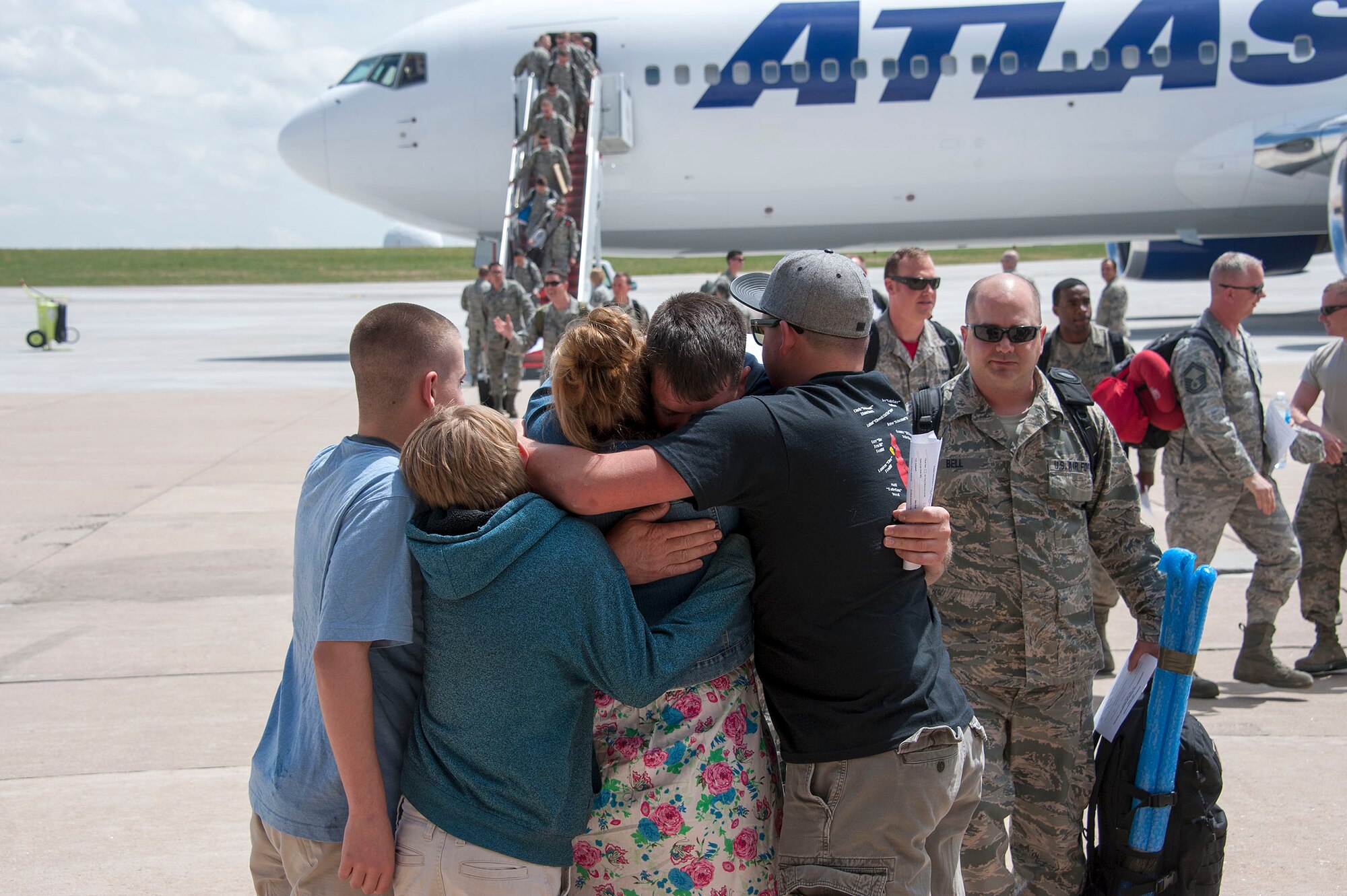 Family and friends of 140th Wing members greet their loved ones with big hugs at Buckley AFB, Colo. May 15, 2015. Over 200 Airmen from the Colorado Air National Guard unit returned home after being deployed as a Theater Security Package to the Republic of Korea for the past three months. (U.S. Air National Guard photo by Senior Master Sgt. John Rohrer) 