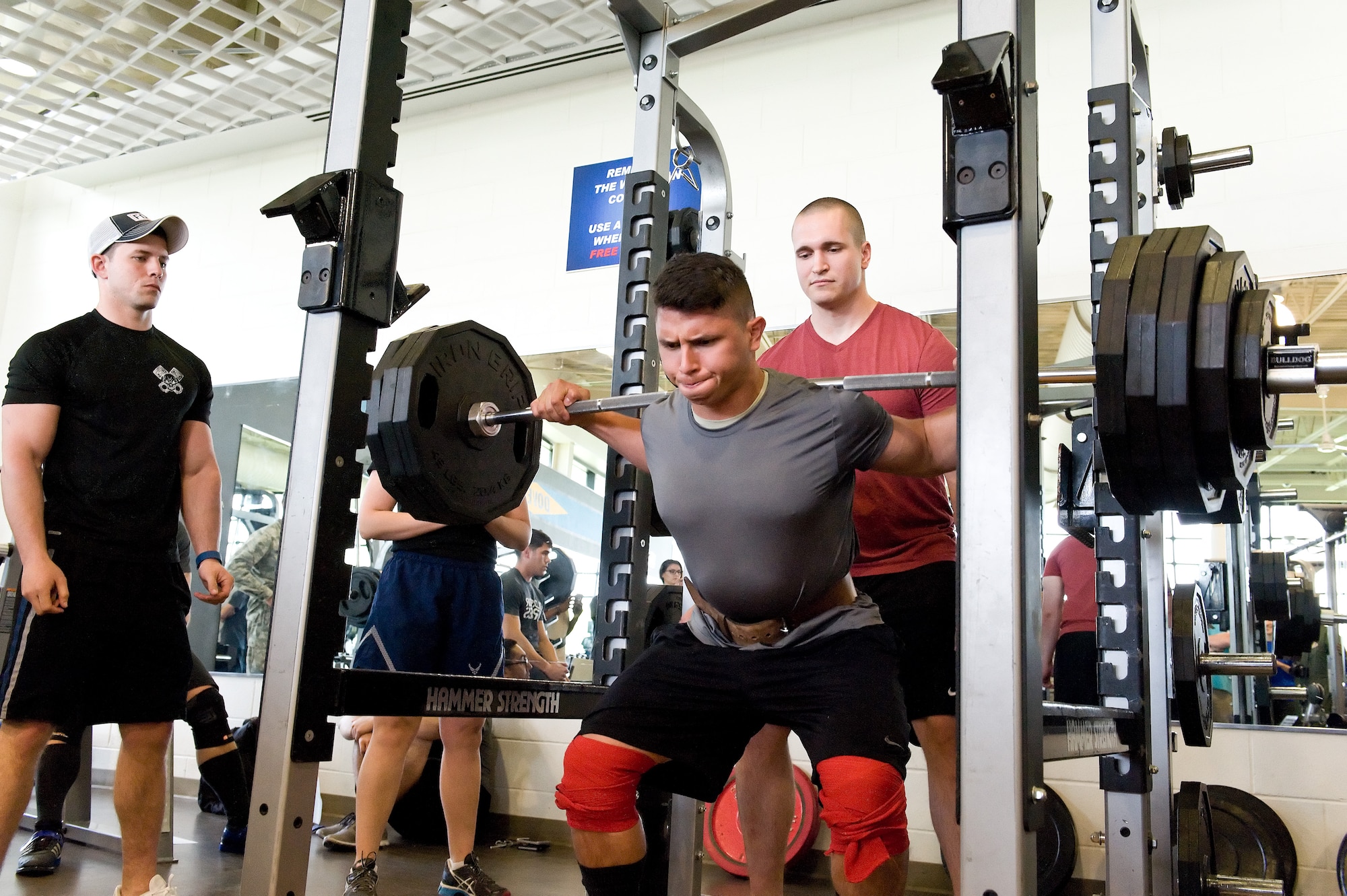Edwin Hernandez squats 405 pounds on his first attempt in the squat during the powerlifting competition May 8, 2015, at the Fitness Center on Dover Air Force Base, Del. Hernandez placed second in the male 181-pound weight class with a combined total of 1,220 pounds. The competition was sponsored by the Dover Chief's Group and used Revolution Powerlifting Syndicate rules to judge competitors on their squat, bench press and deadlift attempts. (U.S. Air Force photo/Roland Balik)