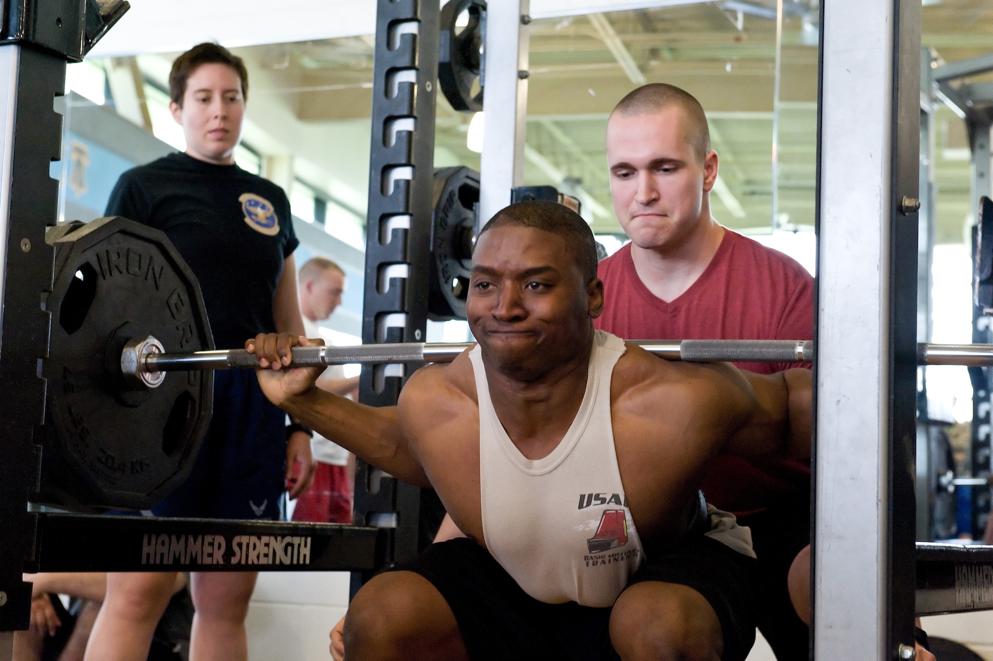 Tavin Alford successfully squats 350 pounds on his first of three attempts in the squat during the powerlifting competition May 8, 2015, at the Fitness Center on Dover Air Force Base, Del. Alford placed first in the male 181-pound weight class and was the overall male winner with a total combined weight of 1,185 pounds for the squat, bench press and deadlift. (U.S. Air Force photo/Roland Balik)