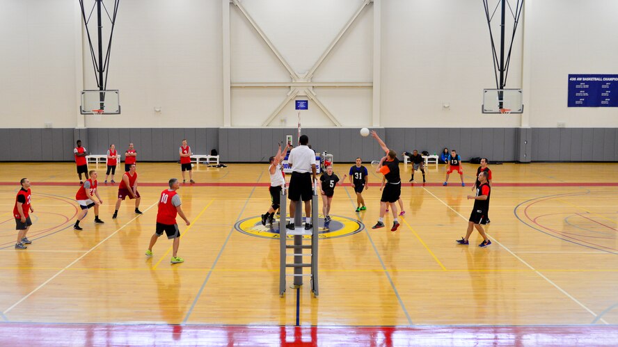 Ryan Mozingo, 9th Airlift Squadron, spikes a volleyball during the intramural volleyball championship game against the combined 436th and 736th Aircraft Maintenance Squadrons May 14, 2015, at the Fitness Center on Dover Air Force Base, Del. AMXS won the first game 25-16, but lost the following two and the championship, 18-25 and 7-15. (U.S. Air Force photo/Airman 1st Class William Johnson)