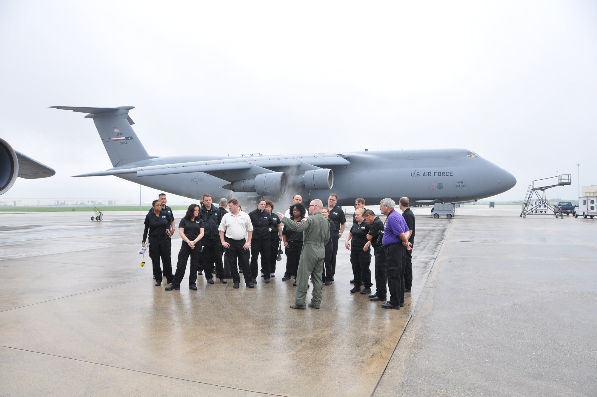 Staff Sgt. Tim Barker, 733rd Training Squadron, briefs members of the DOD Executive Leadership Development Program on the specifics of an Air Force Reserve Command assigned C-5A Galaxy during a visit to 433rd Airlift Wing at Joint Base San Antonio-Lackland, Texas on May 14, 2015. (U.S. Air Force photo by Capt. Philip Cortez) 