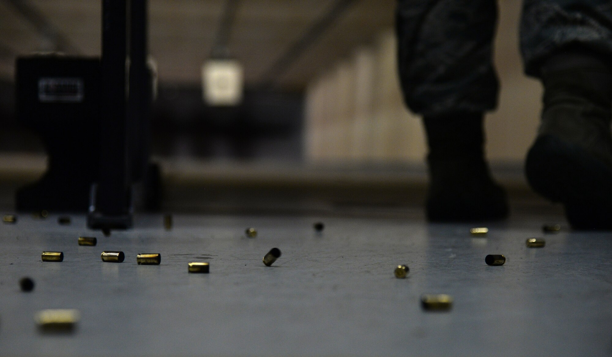 Shell casings lay on the ground during the team shoot competition to celebrate National Police Week, May 14, 2015, Keesler Air Force Base, Miss. The 81st Security Forces Squadron held different events throughout the week to honor fallen security forces and Mississippi state law enforcement while educating the public on law enforcement duties and programs. (U.S. Air Force photo by Senior Airman Holly Mansfield)