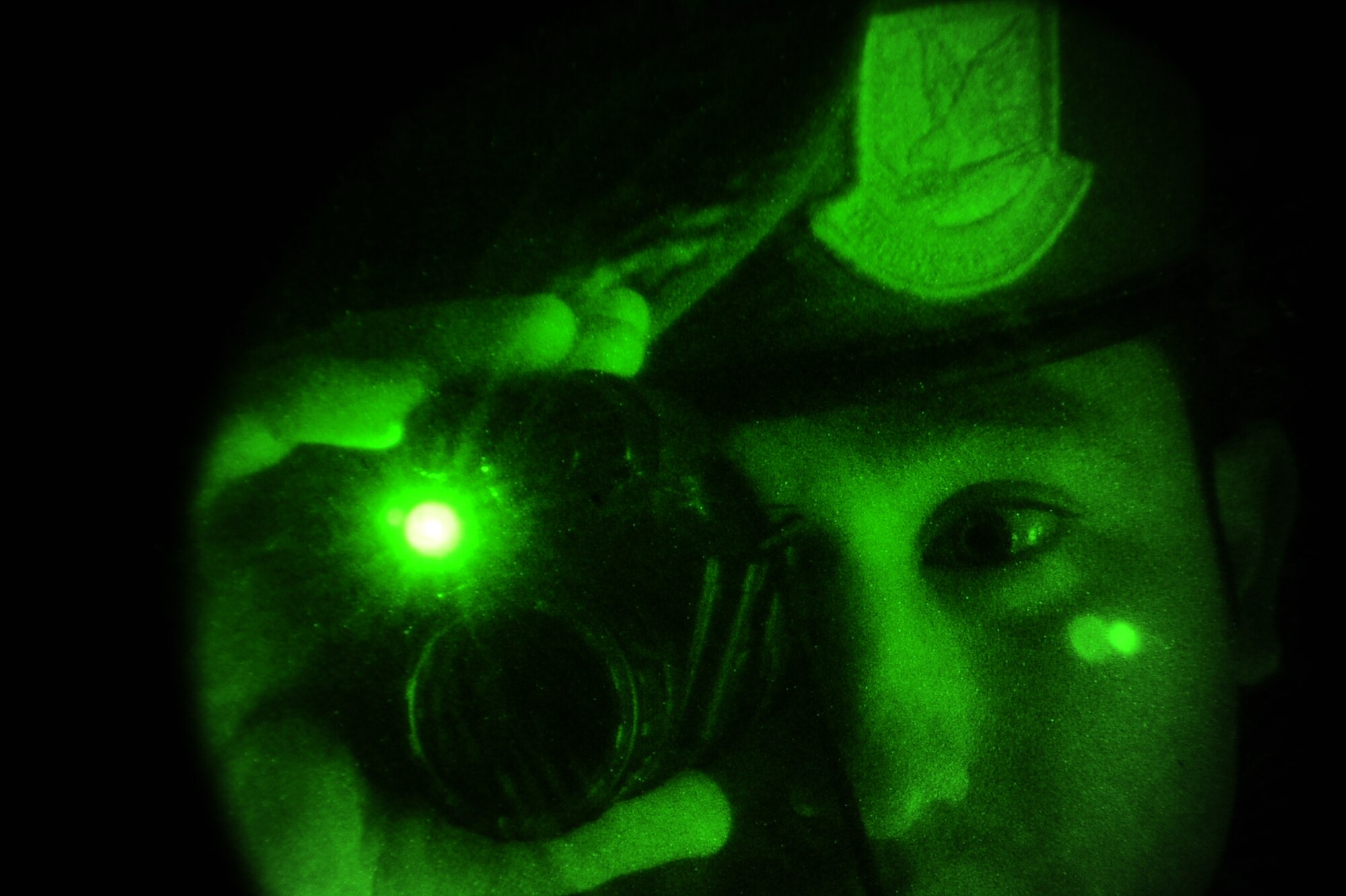 Tech. Sgt. John Flores, 14th Security Forces Squadron, utilizes night vision capabilities during a Security Forces demonstration for Police Week. Police Week, established by a joint resolution in Congress in 1962, is a collaborative effort of many organizations dedicated to honoring America's law enforcement community. (U.S. Air Force photo/Airman Daniel Lile)