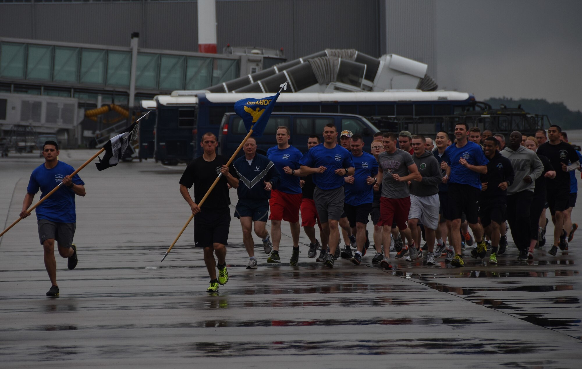 Staff Sgt. Matthew Cortes and Airman 1st Class Sean Hastings, air transportations specialists with the 721st Aerial Port Squadron, lead a group of fellow aerial porters during the 2015 Port Dawg Memorial Run May 15, 2015, at Ramstein Air Base, Germany. The group consisted of aerial porters from the 721st Air Mobility Operations Wing, 721st Aerial Port Squadron, 32nd Aerial Port Squadron, 603rd Air Operations Center, 435th Air Mobility Squadron, 86th Logistics Readiness Squadron and Headquarters U.S. Air Forces in Europe. (U.S. Air Force photo by Staff Sgt. Jonathan Hehnly)
