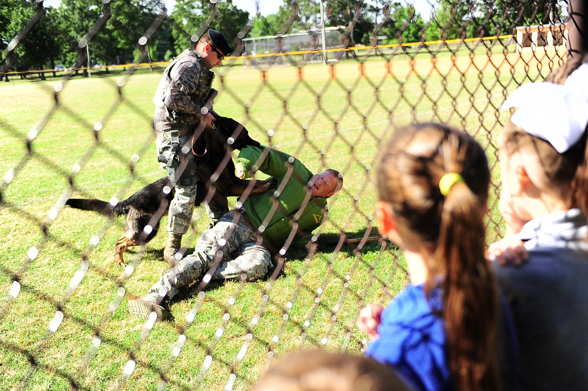 Tech. Sgt. Dustin Weeks, 14th Security Forces Squadron Military Working Dog Handler, gets attacked by a military working dog while conducting a MWD demonstration during National Police Week. Security Forces and local law enforcement demonstrated their capabilities and day-to-day jobs to the base and the public. (U.S. Air Force photo/Airman Daniel Lile)