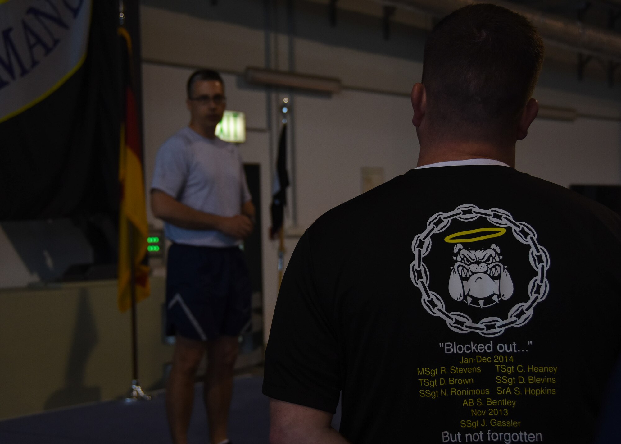Lt. Col. Kyle Korver, 721st Aerial Port Squadron commander, addresses air transportation specialists from around the local area who gathered for the 2015 Port Dawg Memorial Run May 15, 2015, at Ramstein Air Base, Germany. The event, held on National Defense Transportation Day, honored the eight aerial porters who lost their lives from November 2013 through December 2014. (U.S. Air Force photo by Staff Sgt. Jonathan Hehnly)