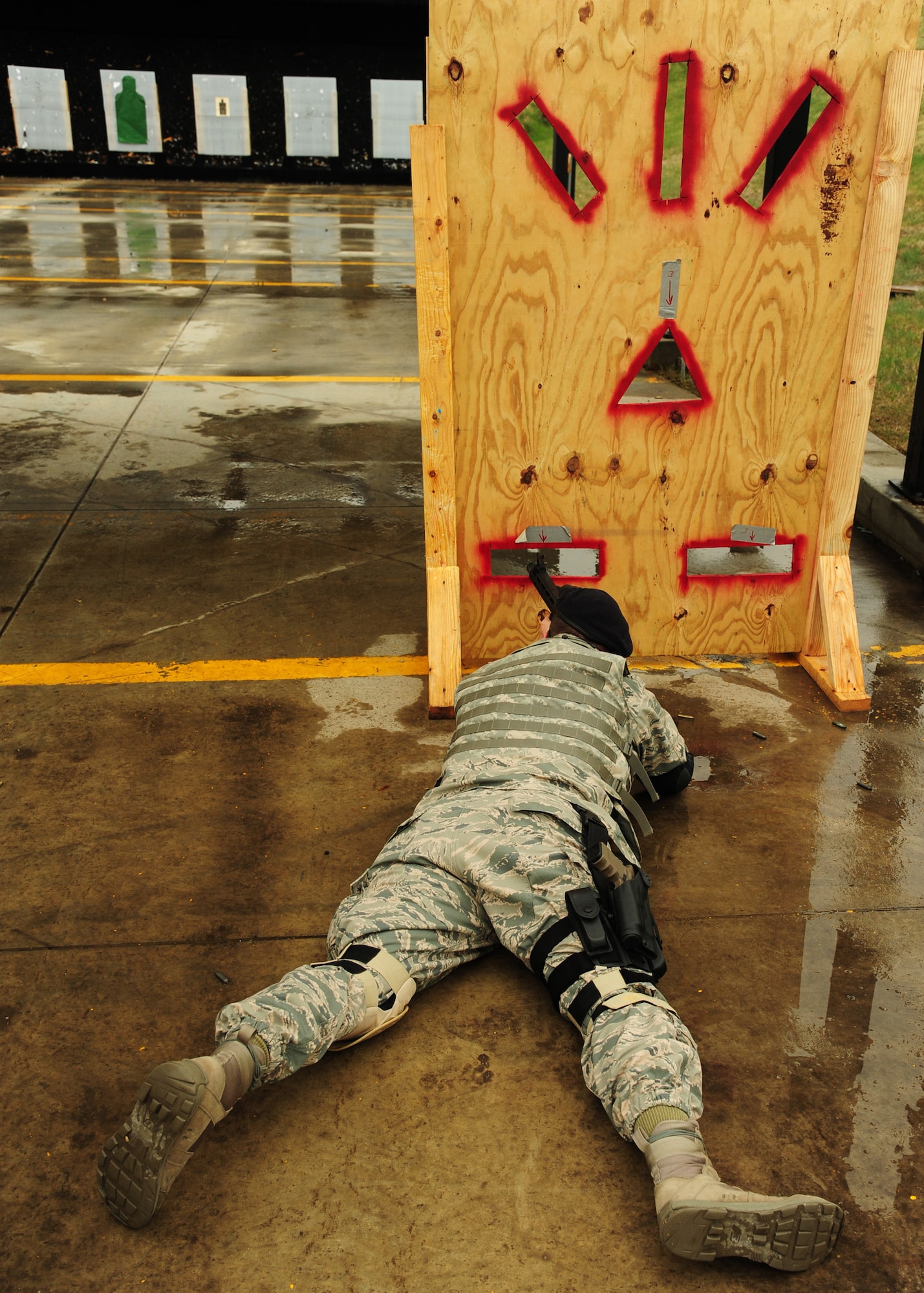 Lt. Col Jeffery Becker, 319th Security Forces Squadron commander, lies in the prone position during the 2nd Annual Police Week Shooting Competition May 13, 2015, at the Grand Forks Public Service Training Center in Grand Forks, N.D. Becker was the first competitor to attempt the course. The competition was organized by the Combat Arms instructors from Grand Forks Air Force Base. (U.S. Air Force photo by Airman 1st Class Ryan Sparks/released)