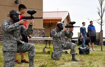 Col. Tom Wilcox (left), 341st Missile Wing commander, competes with Chief Master Sgt. Timothy Davidson (right), 341st Medical Group superintendent, during a paintball competition at the Wing Sports Smackdown May 13 at Malmstrom Air Force Base, Mont. During the smackdown, Airmen had the opportunity to compete in several events and game stations. (U.S. Air Force photo/Airman 1st Class Collin Schmidt)