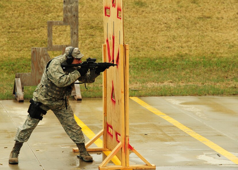 Lt. Col. Edward Phillips, 319th Civil Engineer Squadron commander, looks down the sights of his rifle May 13, 2015, during the 2nd Annual Police Week Shooting Competition at the Grand Forks Public Service Training Center in Grand Forks, N.D. Phillips and his teammate Senior Airman Cody Krissinger, 319th CES firefighter, won first place in the competition. (U.S. Air Force photo by Airman 1st Class Ryan Sparks/released)