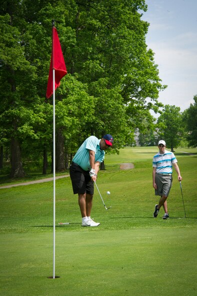 Col. Elvert Gardner, National Defense University student, hits a chip-shot during the 2015 National Police Week golf tournament at Joint Base Andrews, Md., May 12, 2015. Established by a joint resolution of Congress in 1962, NPW pays special recognition to those law enforcement officers who have lost their lives in the line of duty for the safety and protection of others. (U.S. Air Force photo/Airman 1st Class Ryan J. Sonnier)