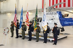 Federal and local law enforcement officers paused during a ceremony on May 15, 2015, at Selfridge Air National Guard Base, Mich., to mark Police Officers Memorial Day.  The event honored the sacrifices of their colleagues who have made the ultimate sacrifice in the line of duty. More than 130 law enforcement officers died while on duty in the U.S. in 2014.  (U.S. Air National Guard photo by Tech. Sgt. Dan Heaton)