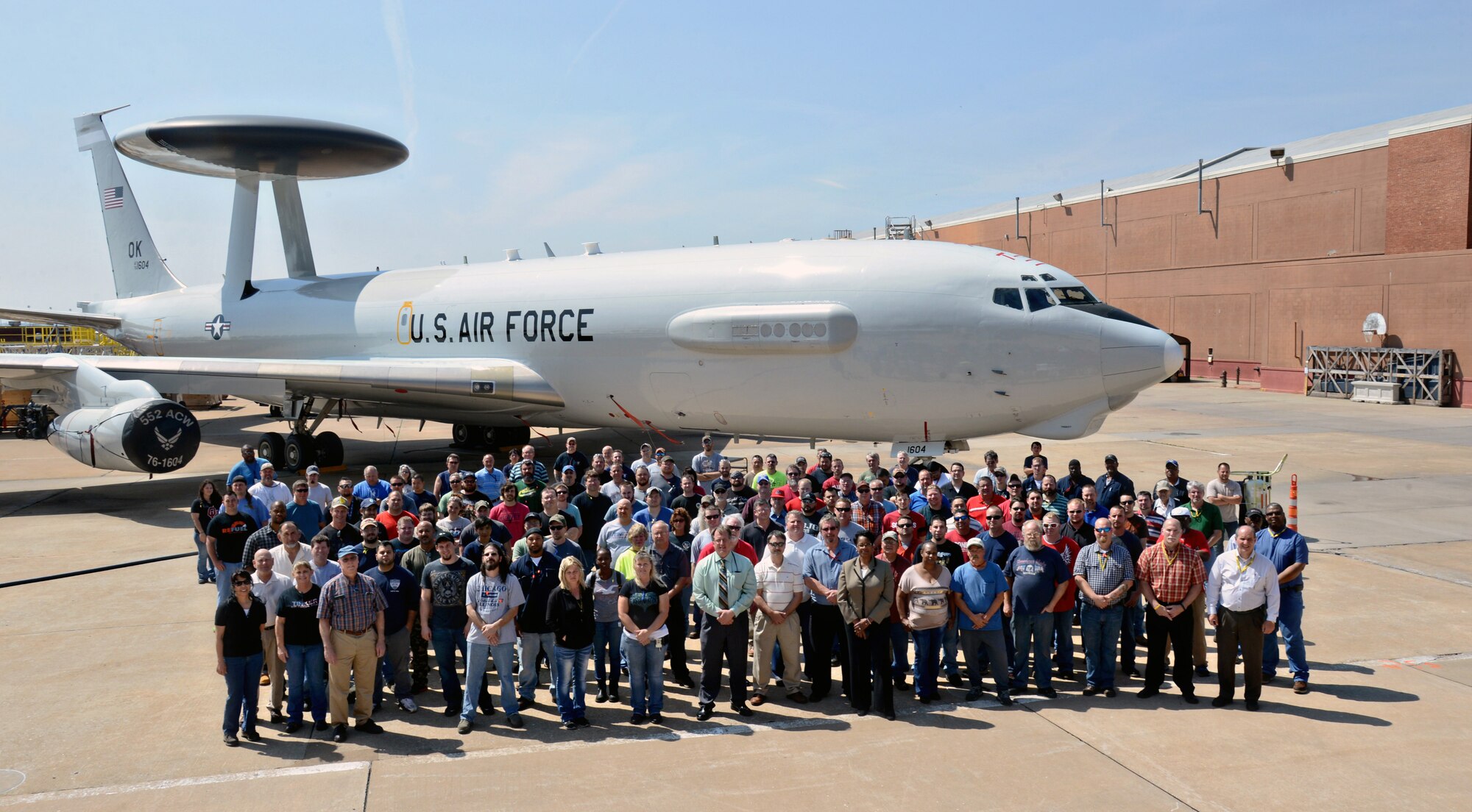 Members of the 566th Aircraft Maintenance Squadron pose with one of the E-3 Airborne Warning and Control System planes they’ve retrofitted with the Block 40/45 technology upgrades. (Air Force photo by Kelly White/Released)
