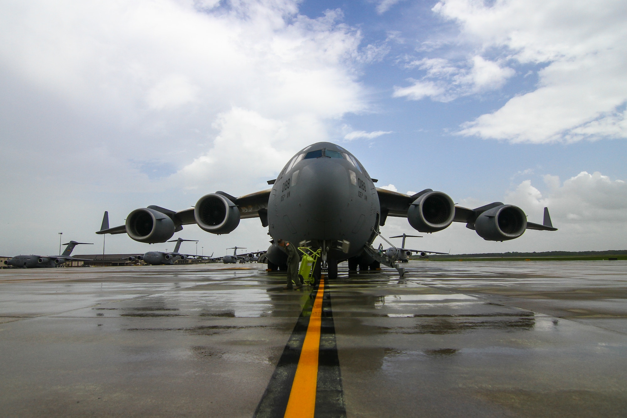 A C-17 Globemaster III from the New York Air National Guard's 105th Airlift Wing sits parked on the flight line on Joint Base McGuire-Dix-Lakehurst, N.J., after a rain storm, May 11, 2015. The New York Air National Guard was assisting the New Jersey National Guard with a deployment exercise. (U.S. Air National Guard photo by Tech. Sgt. Matt Hecht/Released)