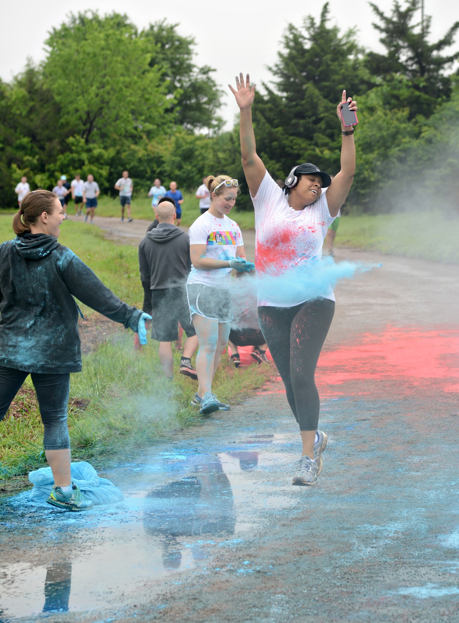 More than 280 people showed up at the Tinker Track to participate in a 5K Color Run on the morning of May 8 as part of last week’s 552nd Air Control Wing Diamond Anniversary Salute. Squadron members flung colors on the runners at various stations along the course. (Air Force photo by Kelly White/Released)