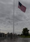 ALTUS AIR FORCE BASE, Okla. – Six members of the 97th Security Forces Squadron prepare and raise the flag for reveille in honor of Police Week at Wings of Freedom Park, May 15, 2015. The ceremony was followed by the placement of a wreath to honor fallen Defenders. (U.S. Air Force photo by Senior Airman J. Zuriel Lee/Released)