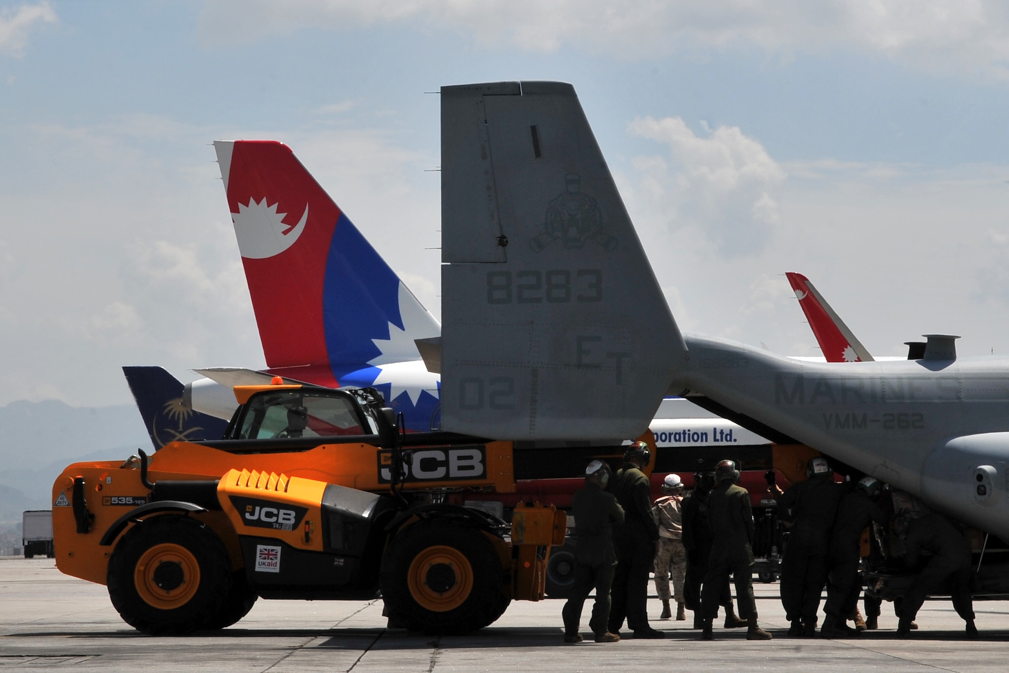 U.S. Air Force Staff Sgt. Josh Foley, 36th Mobility Response Squadron aerial port supervisor, loads relief supplies onto a U.S. Marine Corps MV-22 Osprey at the Tribhuvan International Airport at Kathmandu, Nepal, May 14, 2015. The 36th Contingency Response Group Airmen are deployed to Nepal from Andersen Air Force Base, Guam. As part of Joint Task Force-505, the CRG responded to the government of Nepal and U.S. Agency for International Development by processing relief supplies and coordinating airfield operations after an earthquake devastated the country April 25, 2015. (U.S. Air Force photo by Staff Sgt. Melissa B. White/Released)