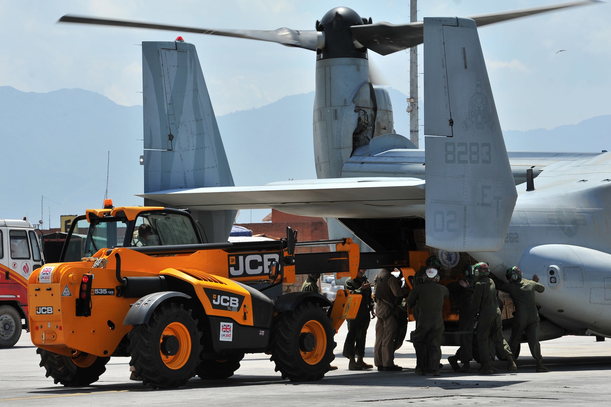 U.S. Air Force Staff Sgt. Josh Foley, 36th Mobility Response Squadron aerial port supervisor, loads relief supplies onto a U.S. Marine Corps MV-22 Osprey May 14, 2015,  at Tribhuvan International Airport, Kathmandu, Nepal. The 36th Contingency Response Group Airmen are deployed to Nepal from Andersen Air Force Base, Guam, as part of Joint Task Force-505 to help the Government of Nepal and U.S. Agency for International Development with airfield operations and processing relief supplies after an earthquake devastated the country April 25, 2015. (U.S. Air Force photo by Staff Sgt. Melissa B. White/Released)