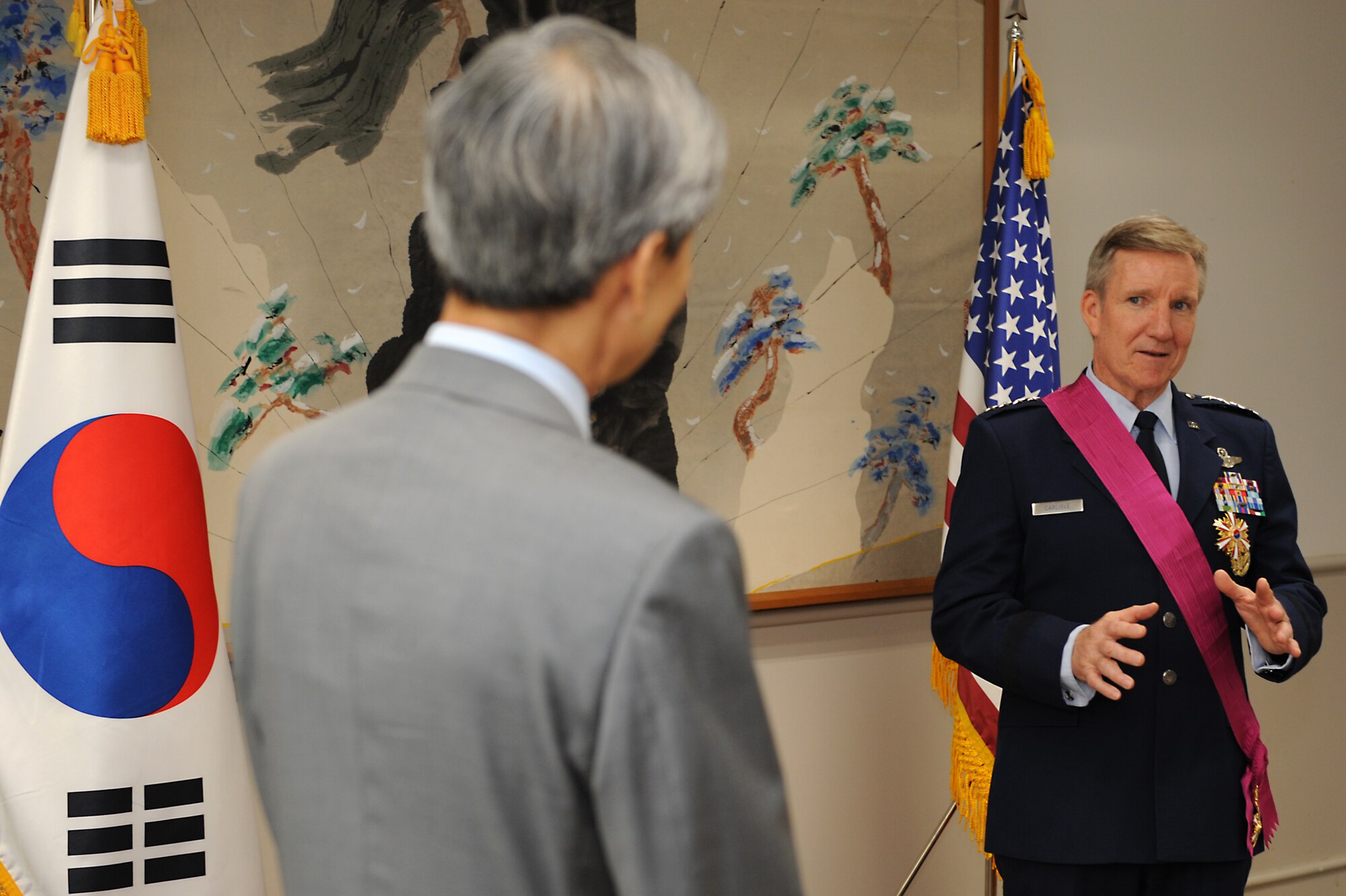 Gen. Hawk Carlisle, commander of Air Combat Command, speaks about what the Order of National Security Merit Tongil Medal means to him after it was presented by Ahn Ho-Young, the Ambassador Extraordinary and Plenipotentiary of the Republic of Korea to the United States of America, at the Embassy of the Republic of Korea in Washington, D.C. May 12, 2015. Carlisle was awarded for his service in promoting military cooperation between the Republic of Korea and the United States. (U.S. Air Force photo by Tech. Sgt. Dan DeCook/Released)
