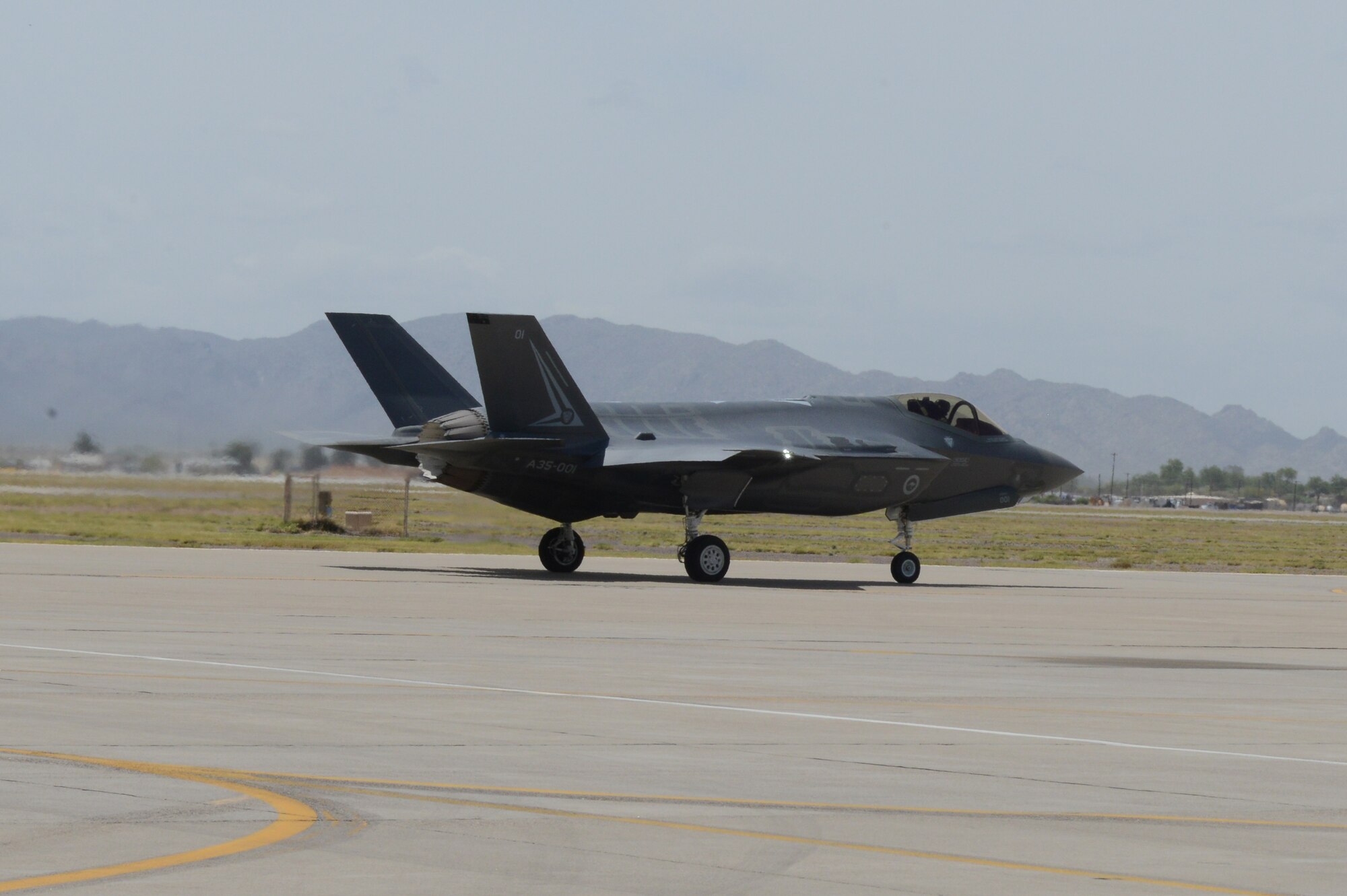 Royal Australian Air Force Maj. Andrew Jackson, 61st Fighter Squadron RAAF squadron leader, taxis out to the runway at Luke Air Force Base, Arizona, May 14, 2015. This flight marks the first F-35 sortie for the RAAF. (U.S. Air Force photo by Senior Airman James Hensley)  