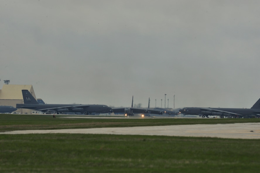 B-52H Stratofortresses prepare to taxi onto the runway on Minot Air Force Base, N.D., May 13, 2015. The B-52s participated in a rapid launch exercise during Constant Vigilance. This is an annual Air Force Global Strike Command exercise conducted with B-52s from Minot and Barksdale. (U.S. Air Force photo/Senior Airman Malia Jenkins)