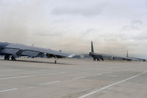 Three B-52H Stratofortresses taxi toward the runway during a rapid launch at Minot Air Force Base, N.D., May 13, 2015. The fly-off event signaled the end of Constant Vigilance, an annual AFGSC exercise designed to train and assess the command's ability to perform its conventional and nuclear missions. Using notional scenarios, command and control elements and operational units effectively demonstrated AFGSC's ability to perform nuclear deterrence operations and long-range strike missions if and when called upon to do so. (U.S. Air Force photo/Senior Airman Kristoffer Kaubisch)