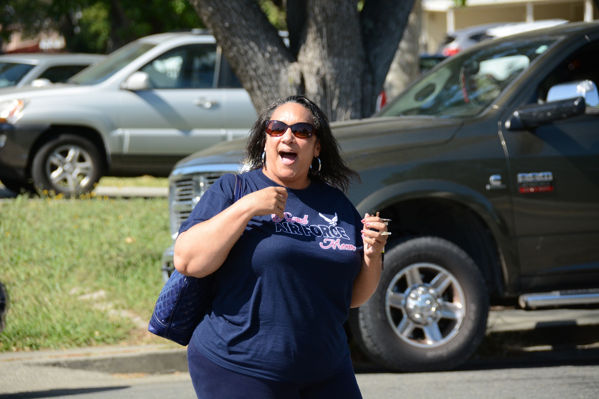 Teri Evans, mother of the late Airman 1st Class Chris Evans, comes home May 9 to her newly repaired house. The 60th Civil Engineer Squadron, Travis First Sergeants Council, along with funding from Goodfellow Air Force Base, Texas, contributed to a repair project involving a new fence, new exterior paint and interior decorations and electrical wiring. (U.S. Air Force photo by Airman 1st Class Amber Carter)