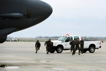 B-52H Stratofortress alert aircrew members run to their aircraft during a Constant Vigilance rapid launch exercise at Minot Air Force Base, N.D., May 13, 2015. While the event tested aircrew and maintainers ability to scramble aircraft, the surge operations also tested the abilities of Air Force Global Strike Command’s  command and control network to quickly plan and provide nuclear deterrence and long-range strike capabilities to the President and combatant commanders. (U.S. Air Force photo/Senior Airman Kristoffer Kaubisch)