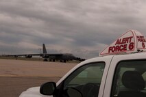 An alert vehicle and B-52H Stratofortress bomber stand ready to support rapid launch operations during Constant Vigilance at Minot Air Force Base, N.D., May 13, 2015. An annual Air Force Global Strike Command exercise, Constant Vigilance is designed to train and assess the command's ability to perform its conventional and nuclear missions. (U.S. Air Force photo/Airman 1st Class Christian Sullivan)