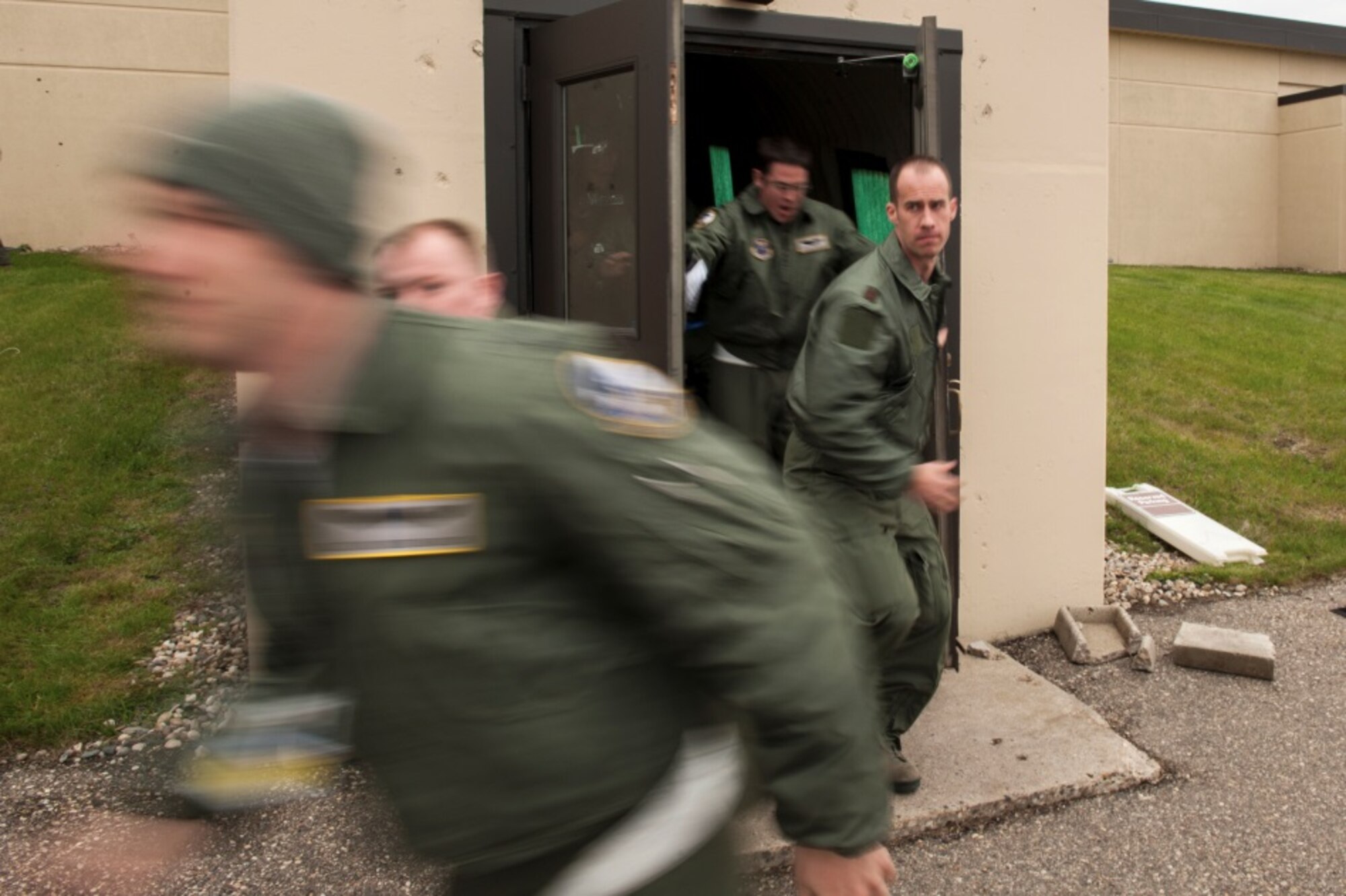 Aircrew members assigned to the 5th Bomb Wing scramble from their alert facility during a Constant Vigilance rapid launch event at Minot Air Force Base, N.D., May 13, 2015. The rapid launch event tested the ability of aircrews, maintainers and other base agencies to work together and quickly provide the President and combatant commanders with airborne nuclear deterrence and long-range strike capabilities. (U.S. Air Force photo/Airman 1st Class Christian Sullivan)