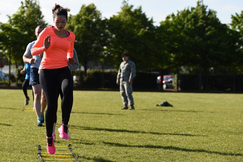 Iliamar Negron, 423rd Force Support Squadron accounting technician, speeds through a ladder run during the National Police Week Warrior Competition at RAF Alconbury, England, May 15, 2015. The events held during the challenge tested competitors’ strength, speed, agility and endurance. (U.S. Air Force photo by Staff Sgt. Jarad A. Denton/Released)