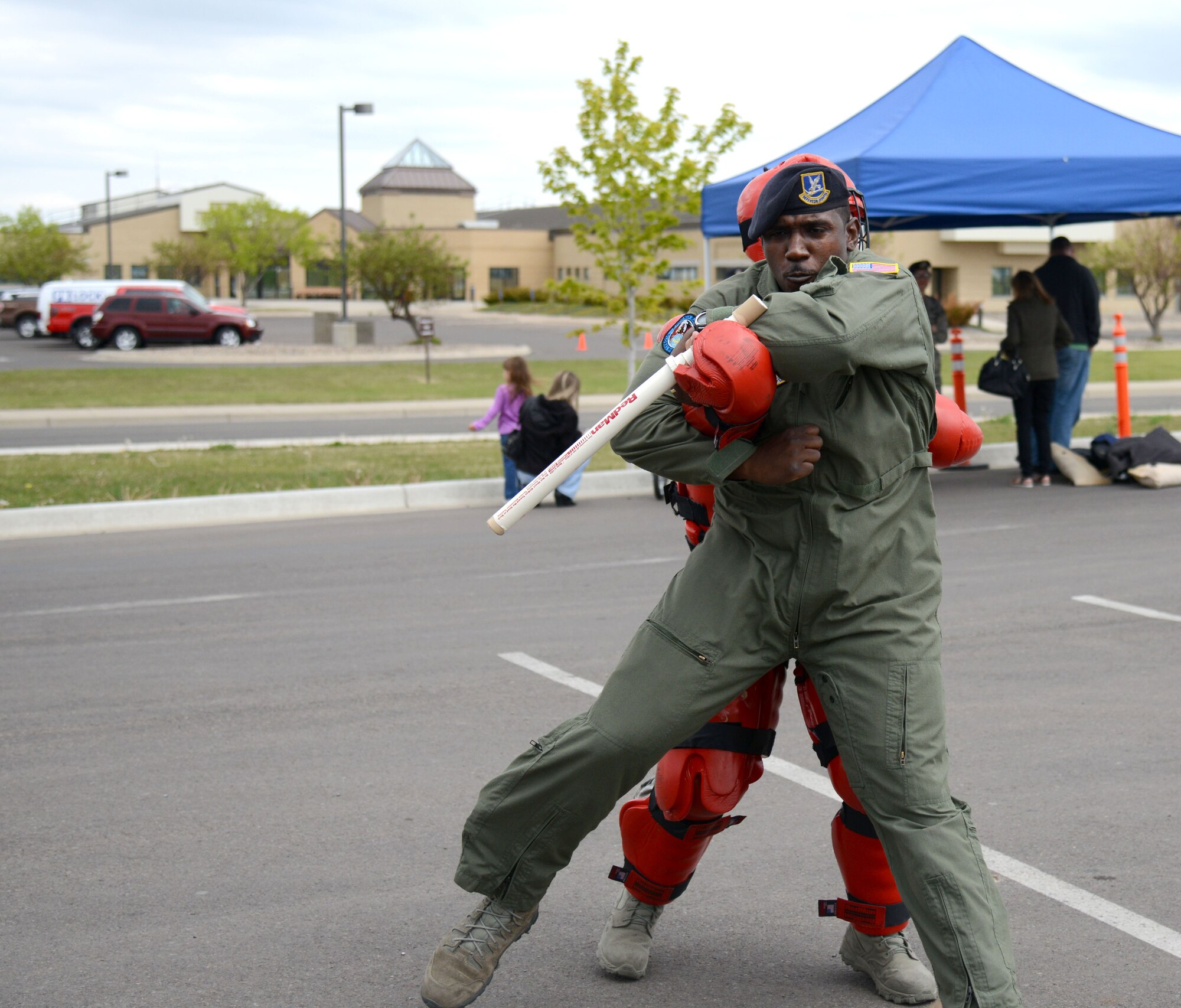 Staff Sgt. Quentin Humphries, 341st Security Forces Squadron response force leader, performs a weapon take-away during a police week demonstration May 13, 2015, at Malmstrom Air Force Base, Mont. Various security forces agencies came out to showcase their unique capabilities. (U.S. Air Force photo/Airman 1st Class Dillon Johnston)