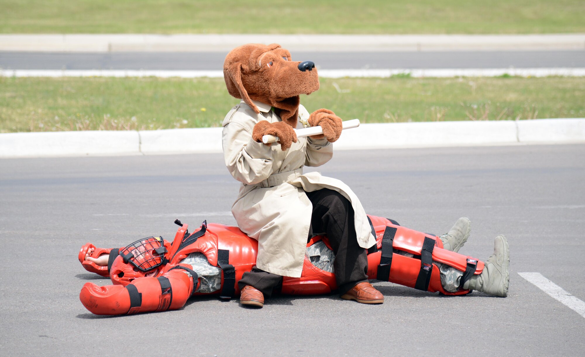 McGruff the crime dog sits on top of an Airman wearing a “red man” suit during a police week demonstration May 13, 2015, at Malmstrom Air Force Base, Mont. Various security forces agencies came out to showcase their unique capabilities. (U.S. Air Force photo/Airman 1st Class Dillon Johnston)