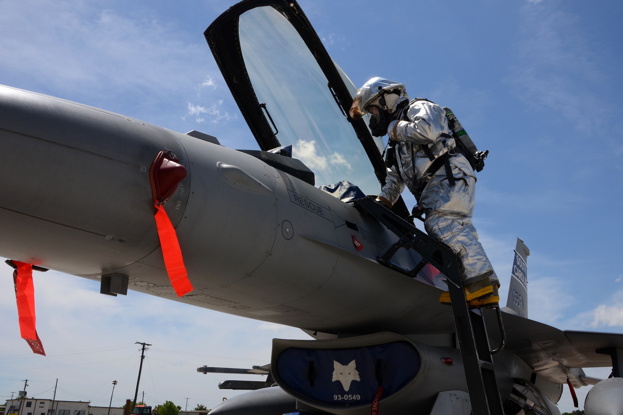 Firefighter Lt. Jason Dukes, a training lieutenant with the 169th Civil Engineer Squadron, secures the cockpit of an F-16 Fighting Falcon during the Major Aircraft Recovery Exercise (MARE) May 6, 2015 at McEntire Joint National Guard Base, S.C. The MARE exercise was a base-wide training simulation to determine how McEntire would respond to an aircraft crash. (U.S. National Guard photo by Amn Megan Floyd/Released)