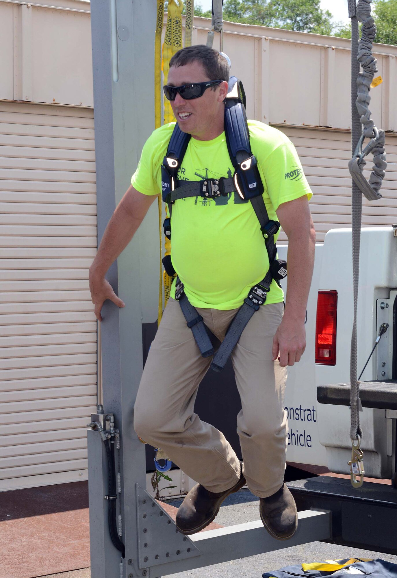 Will Bazela, a representative from Capital Safety, demonstrates the safety features of
various harnesses and attachments for fall protection, May 11, 2015. (U.S. Air Force photo by Tommie Horton)