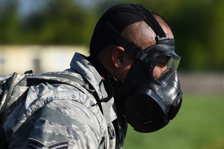 Staff Sgt. Norvell Howard, 422nd Security Forces Squadron unit trainer crosses the finish line after completing a five kilometer ruck march around RAF Croughton, England, May 11, 2015. The ruck march was held in support of National Police Week, which honored law enforcement officers who gave their lives in the line of duty. (U.S. Air Force photo by Staff Sgt. Jarad A. Denton/Released)