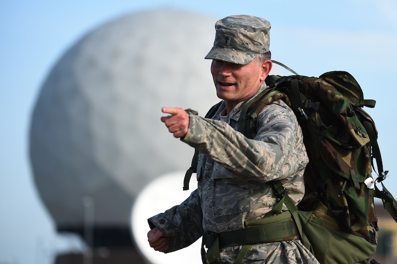 Chaplain (Maj.) Jack Stanley, 422nd Air Base Group chaplain, motivates fellow Airmen during a National Police Week ruck march around RAF Croughton, England, May 11, 2015. Stanley participated in the run to honor his father, a 35-year police veteran who is currently battling Parkinson’s disease. (U.S. Air Force photo by Staff Sgt. Jarad A. Denton/Released)