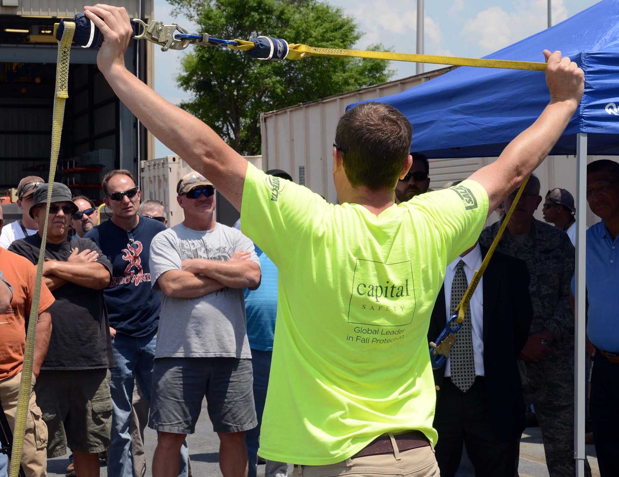 Will Bazela, a Capital Safety representative, demonstrates Monday the safety features of various harnesses and attachments for fall protection. Anyone who uses a Personal Fall Arrest System should receive training annually, when work conditions change or new fall arrest systems are used. (U.S. Air Force photo by Tommie Horton)