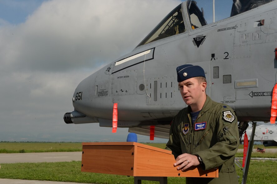 U.S. Air Force Lt. Col. Ryan Hayde, 354th Expeditionary Fighter Squadron commander, prepares to address the 354th EFS during a change-of-command ceremony May 15, 2015, on the flightline, at Campia Turzii, Romania. A change of command is a military tradition that represents a formal transfer of authority and responsibility for a unit from one commanding office to another. (U.S. Air Force photo by Senior Airman Dylan Nuckolls/Released)