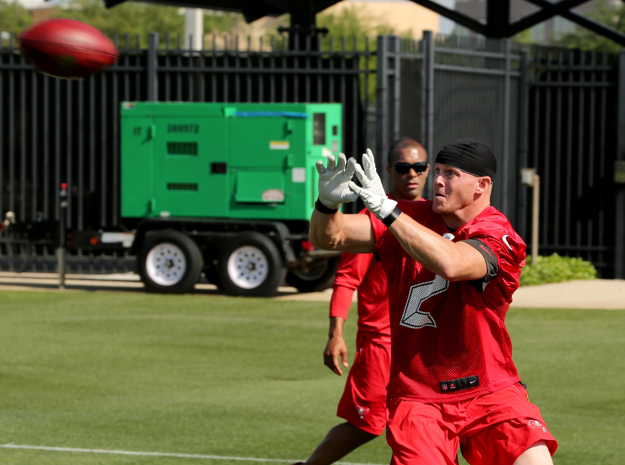 1st Lt. Connor Dietz, 6th Logistics Readiness Squadron material management flight commander, catches a pass during his workout at One Buc Place in Tampa, Fla., April 10, 2015. Dietz's present goals are to get into camp with an NFL team and eventually make it onto a roster. (Courtesy Photo)