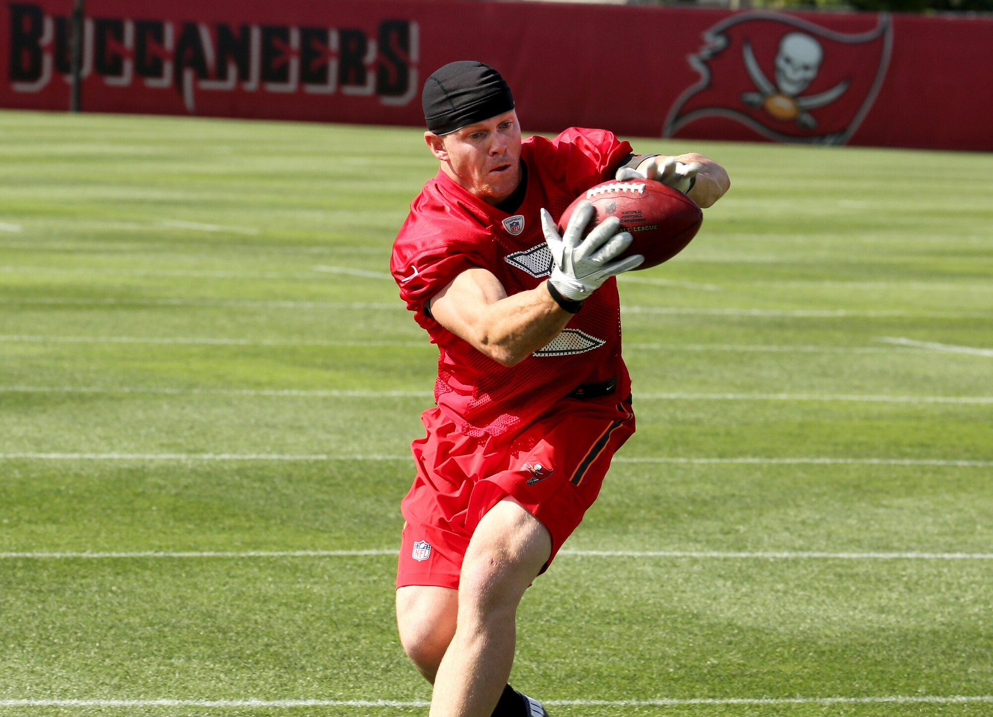 1st Lt. Connor Dietz, 6th Logistics Readiness Squadron material management flight commander, catches a pass during his workout at One Buc Place in Tampa, Fla., April 10, 2015. Dietz's present goals are to get into camp with an NFL team and eventually make it onto a roster. (Courtesy Photo)