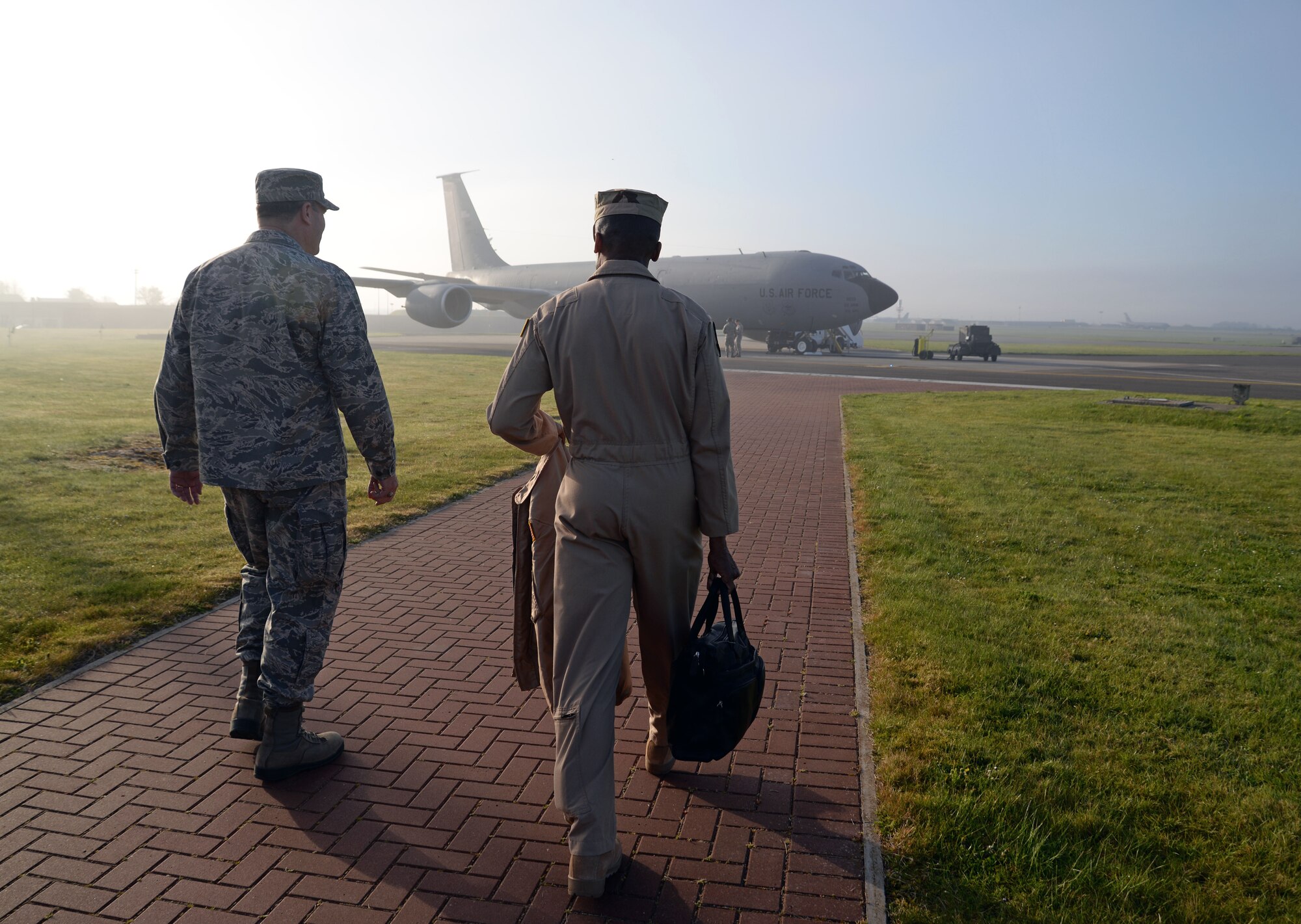 U.S. Air Force Col. Kenneth T. Bibb, Jr., left, 100th Air Refueling Wing commander, and U.S. Air Force Gen. Darren W. McDew, right, Air Mobility Command commander, walk to a KC-135 Stratotanker on the flightline, April 22, 2015, on RAF Mildenhall, England. McDew visited RAF Mildenhall for a day, meeting Airmen from different squadrons and learning first-hand how Team Mildenhall refuels the fight. (U.S. Air Force photo by Senior Airman Christine Halan/Released)