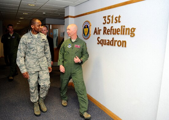 U.S. Air Force Gen. Darren W. McDew, left, Air Mobility Command commander, receives a tour of the 351st Air Refueling Squadron from U.S. Air Force Col. Noel Bradford, right, 100th Operations Group commander, April 21, 2015, on RAF Mildenhall, England. McDew visited RAF Mildenhall for a day, meeting Airmen from different squadrons and learning first-hand how Team Mildenhall refuels the fight. (U.S. Air Force Photo by Staff Sgt. Krystie Martinez/Released)