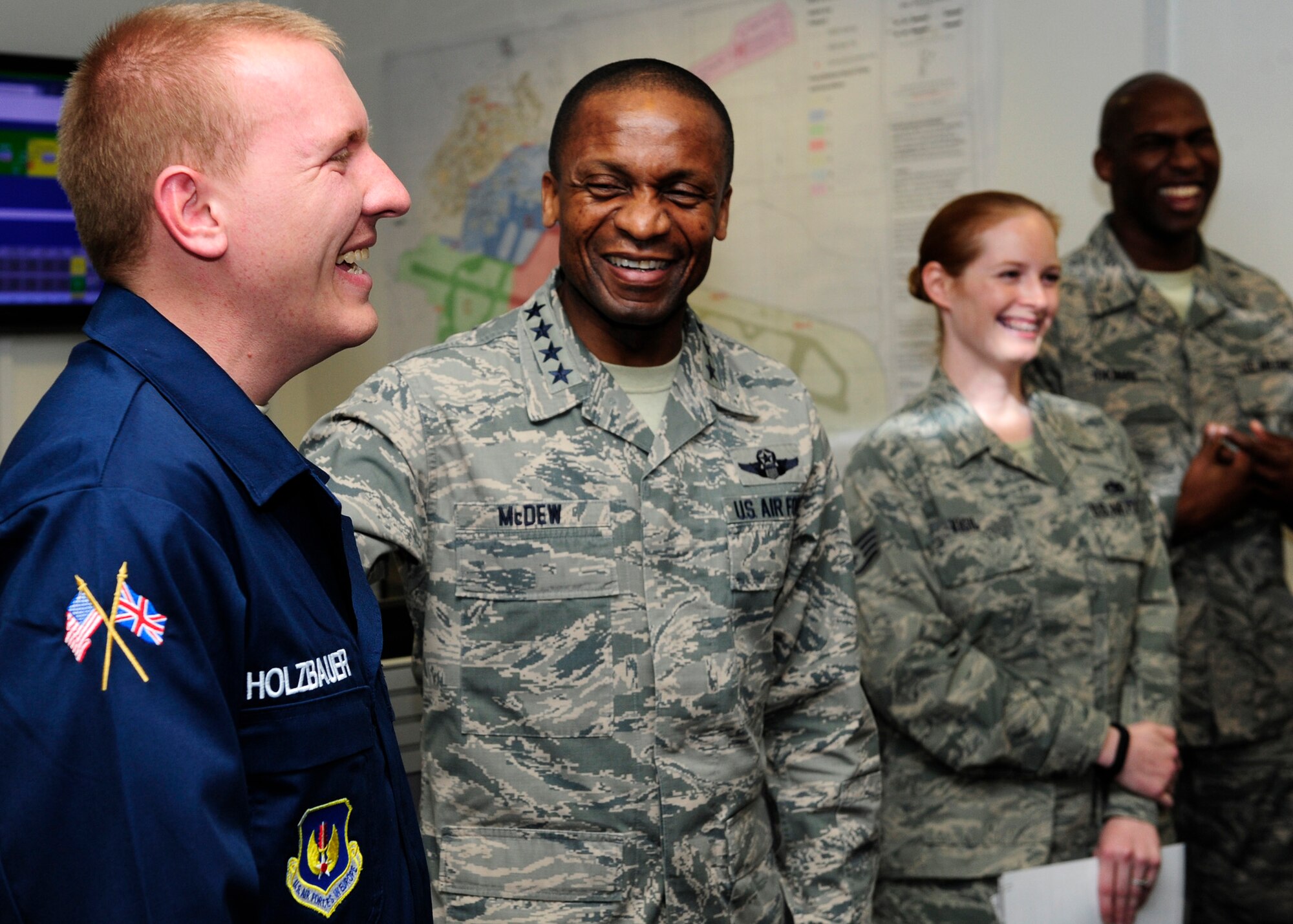 U.S. Air Force Gen. Darren W. McDew, Air Mobility Command commander, speaks with Airmen from the 100th Maintenance Group and 100th Aircraft Maintenance Squadron during a base tour April 21, 2015, on RAF Mildenhall, England. McDew visited RAF Mildenhall for a day, meeting Airmen from different squadrons and learning first-hand how Team Mildenhall refuels the fight. (U.S. Air Force Photo by Staff Sgt. Krystie Martinez/Released)