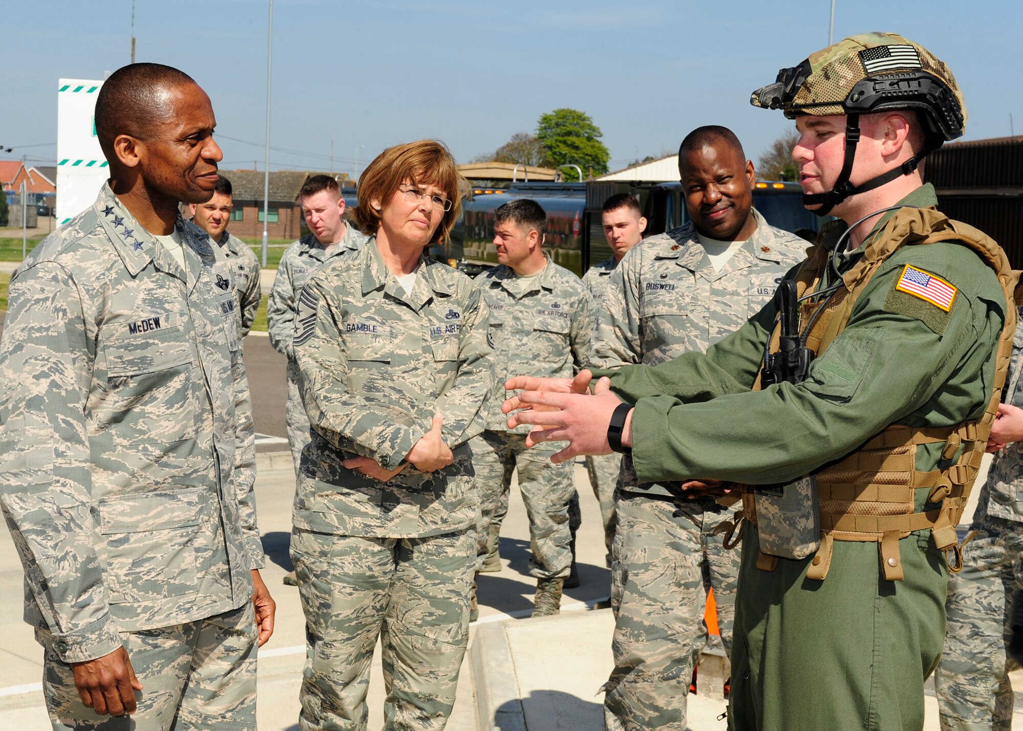 U.S. Air Force Gen. Darren W. McDew, Air Mobility Command commander, and U.S. Air Force Chief Master Sgt. Victoria Gamble, Air Mobility Command command chief, receive a Forward Area Refueling Point briefing April 21, 2015from U.S. Air Force Senior Airman Anthony Davis, 100th Logistics Readiness Squadron FARP program manager from Lancaster, Calif., on RAF Mildenhall, England. McDew and Gamble visited RAF Mildenhall for a day, meeting Airmen from different squadrons and learning first-hand how Team Mildenhall refuels the fight. (U.S. Air Force Photo by Staff Sgt. Krystie Martinez/Released)