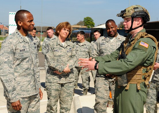 U.S. Air Force Gen. Darren W. McDew, Air Mobility Command commander, and U.S. Air Force Chief Master Sgt. Victoria Gamble, Air Mobility Command command chief, receive a Forward Area Refueling Point briefing April 21, 2015from U.S. Air Force Senior Airman Anthony Davis, 100th Logistics Readiness Squadron FARP program manager from Lancaster, Calif., on RAF Mildenhall, England. McDew and Gamble visited RAF Mildenhall for a day, meeting Airmen from different squadrons and learning first-hand how Team Mildenhall refuels the fight. (U.S. Air Force Photo by Staff Sgt. Krystie Martinez/Released)