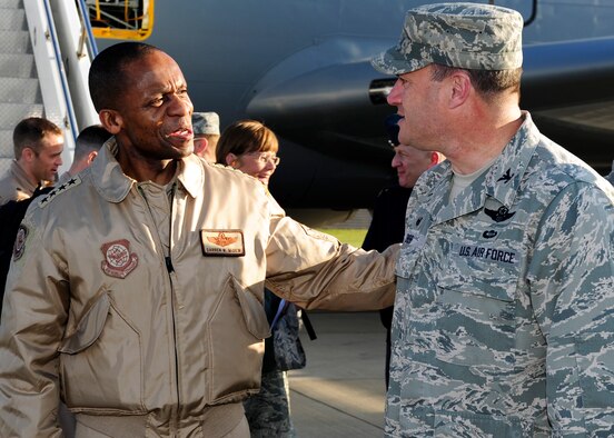 U.S. Air Force Col. Kenneth T. Bibb, Jr., right, 100th Air Refueling Wing commander, greets U.S. Air Force Gen. Darren W. McDew, left, Air Mobility Command commander, as he arrives April 21, 2015, on RAF Mildenhall, England. McDew visited RAF Mildenhall for a day, meeting Airmen from different squadrons and learning first-hand how Team Mildenhall refuels the fight. (U.S. Air Force Photo by Staff Sgt. Krystie Martinez/Released)