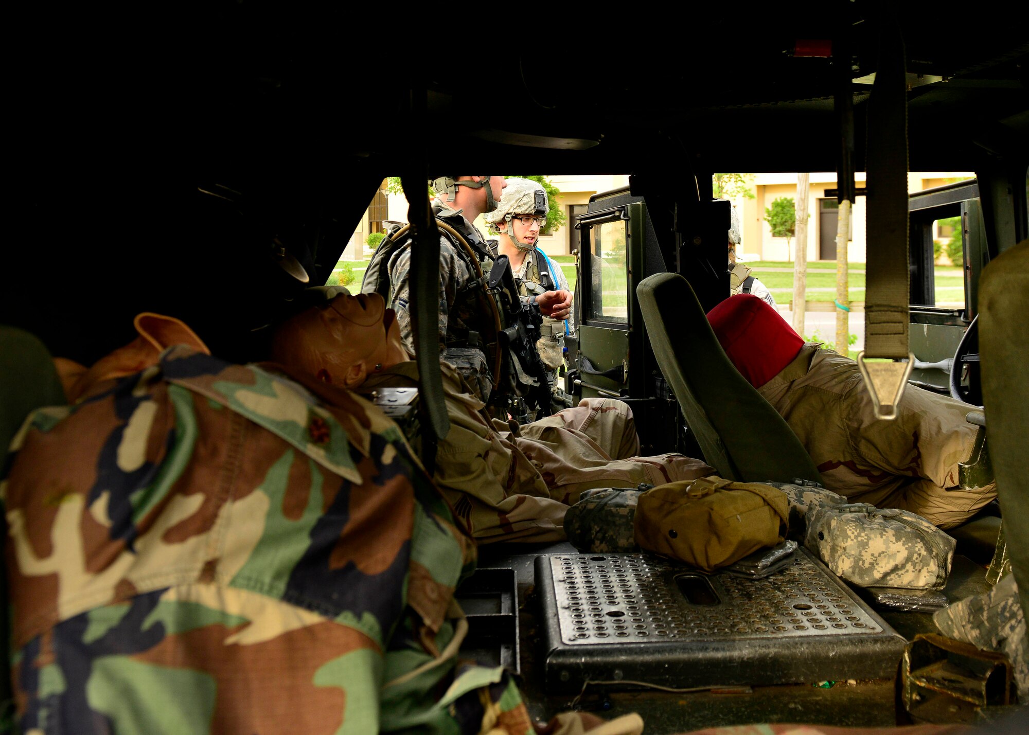 U.S. Air Force defenders treat simulated injured victims during the Security Forces Squadron Fire Team Challenge for Police Week, May 13, 2015, at Aviano Air Base, Italy.  The scenario was one of 12 stations set up to test mental and physical strength.  (U.S. Air Force photo by Airman 1st Class Cary Smith/Released)