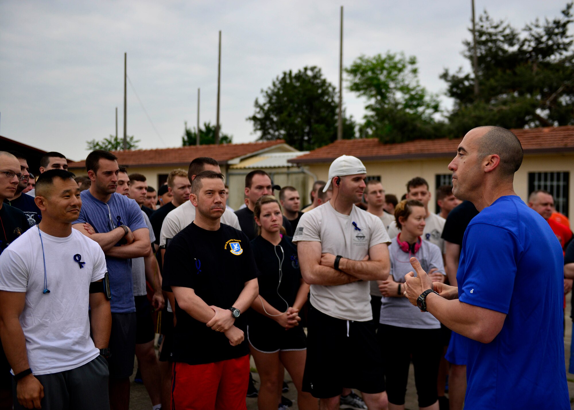 U.S. Air Force Lt. Col. Damian Schlussel speaks with Airmen about honoring fallen law enforcement before the start of a “cops and robbers” 5k run during Police Week, May 12, 2015, at Aviano Air Base, Italy.  During the week, ceremonies, memorials and other events took place to honor the men and women who have served in the line of duty. (U.S. Air Force photo by Airman 1st Class Cary Smith/Released)